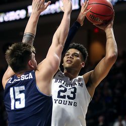 Brigham Young Cougars forward Yoeli Childs (23) tries to put up a shot with San Diego Toreros forward Alex Floresca (15) defending as the BYU Cougars and San Diego Toreros play in WCC tournament action at the Orleans Arena in Las Vegas on Saturday, March 9, 2019.