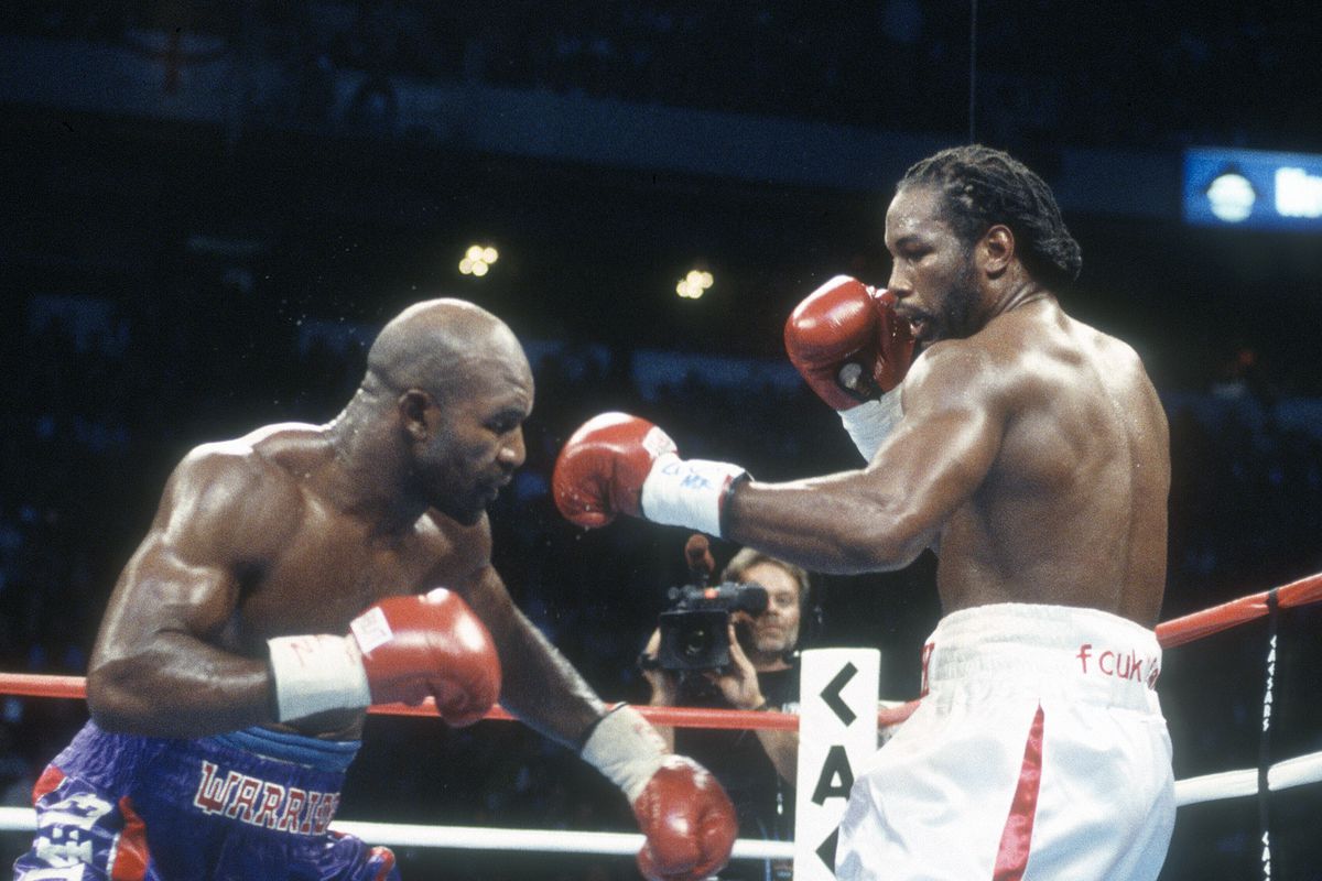 Lennox Lewis and Evander Holyfield fight for the WBC, WBA, IBF and Lineal heavyweight titles on March 13, 1999 at Madison Square Garden in the Manhattan borough of New York City.