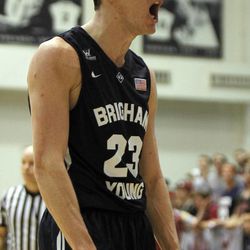 BYU guard Skyler Halford reacts to a teammate getting fouled after making a shot during the second half of an NCAA college basketball game against Loyola Marymount in Los Angeles, Saturday, Feb. 7, 2015. BYU won 87-68.