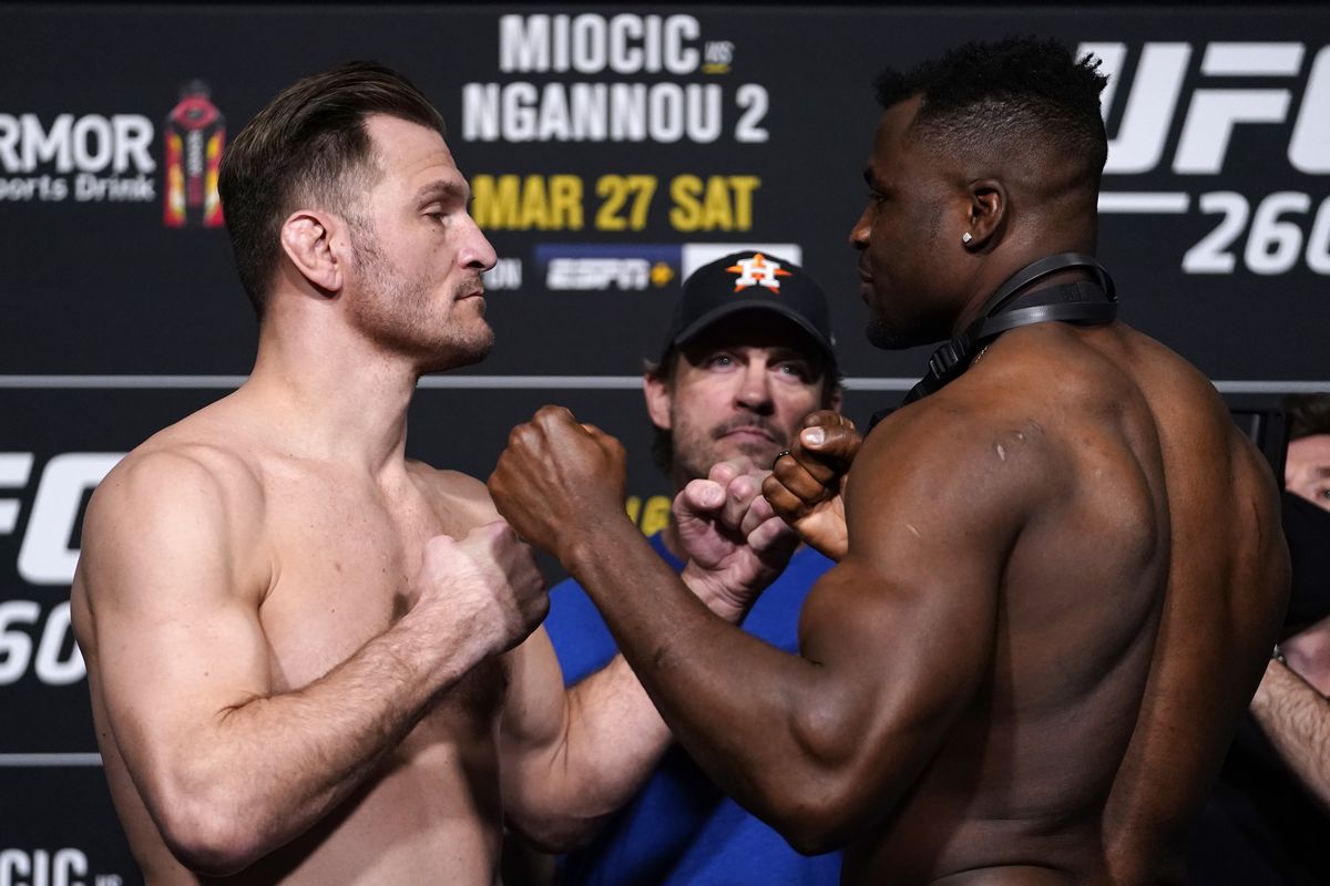 Opponents Stipe Miocic and Francis Ngannou of Cameroon face off during the UFC 260 weigh-in at UFC APEX on March 26, 2021 in Las Vegas, Nevada.