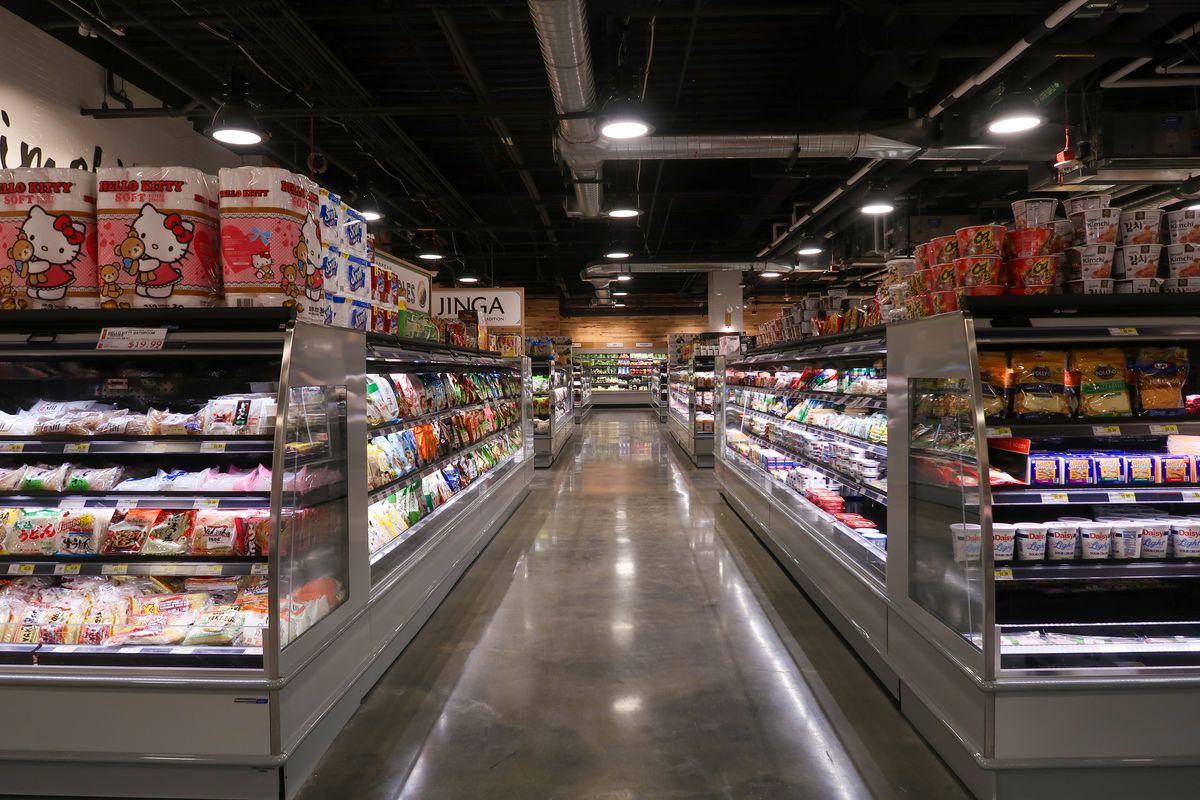 The inside of an H Mart with various brands on display.