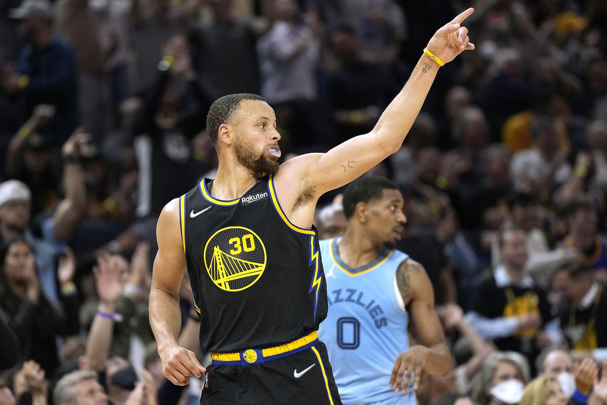 Stephen Curry #30 of the Golden State Warriors reacts after making a three-point shot against the Memphis Grizzlies during the second half of Game Three of the Western Conference Semifinals of the NBA Playoffs at Chase Center on May 07, 2022 in San Francisco, California.