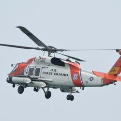 A U.S. Coast Guard helicopter crew simulates a water rescue Saturday at the Air & Water Show. | Colin Boyle/Sun-Times