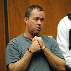Mark Kerrigan, 45, the brother of Olympic figure skater Nancy Kerrigan, reacts as he is arraigned in Woburn, Mass., District Court in January.