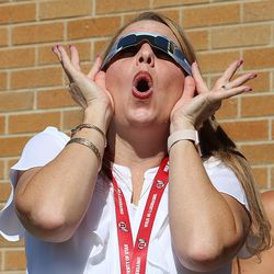 Crestview Elementary Principal Teri Ann Cooper reacts as she sees the eclipse from the Salt Lake City school on Monday, Aug. 21, 2017.