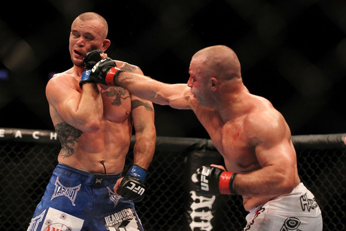 Matt Serra punches Chris Lytle in the face at UFC 119, his final Octagon appearance.