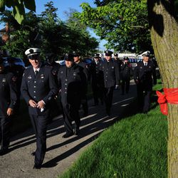 Firefighters arrive for visitation services for Firefighter Juan Bucio at St. Rita of Cascia Shrine Chapel. | Victor Hilitski/For the Sun-Times