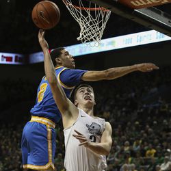 Oregon's Payton Pritchard, left, goes up for two against UCLA's Lonzo Ball during the first half of an NCAA college basketball game Wednesday Dec. 28, 2016, in Eugene, Ore. 