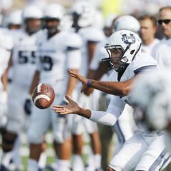 Utah State Aggies quarterback Chuckie Keeton (16) takes a pre game snap prior to the game against Wake Forest  in Logan  Saturday, Sept. 13, 2014. 