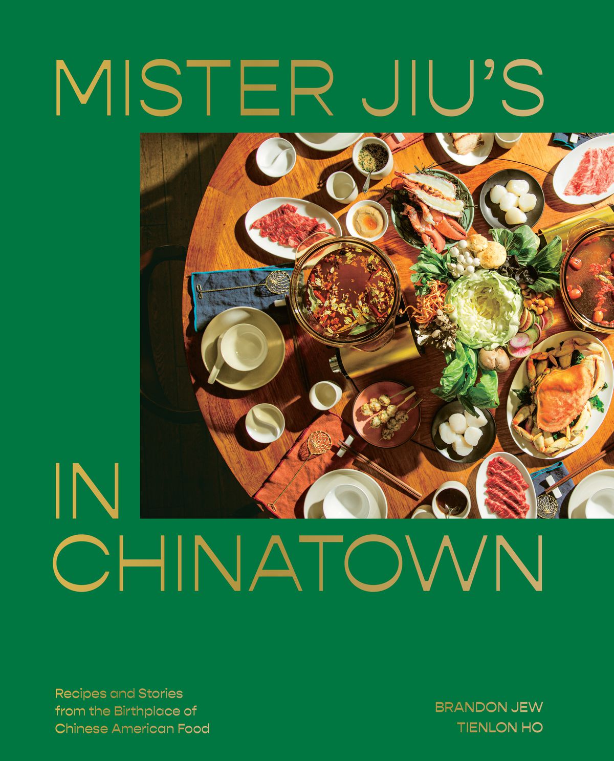 On the cover of Mister Jiu’s Chinatown cookbook, a table is set with a feast.