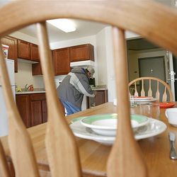 Alan Brown, a candidate for residency at the new Grace Mary Manor, inspects one of the units during an open house on Wednesday.