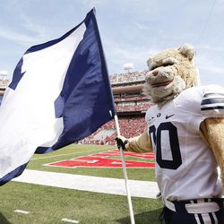 Brigham Young's Cosmo the Cougar holds a flag  in Lincoln Saturday, Sept. 5, 2015. BYU won 33-28 on a last-second touchdown pass. 