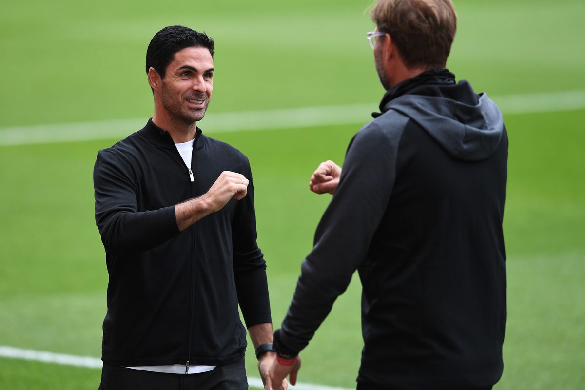 Mikel Arteta the Arsenal Head Coach says hello to Jurgen Klopp the Liverpool Manager before the Premier League match between Arsenal FC and Liverpool FC at Emirates Stadium on July 15, 2020 in London, England.