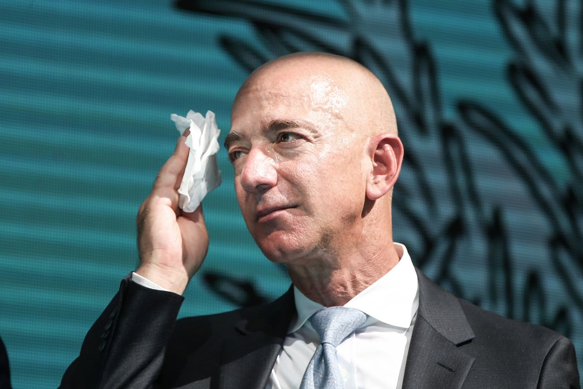 Amazon CEO and Washington Post owner Jeff Bezos using a handkerchief to blot perspiration from his face in Istanbul, Turkey, on October 2, 2019.