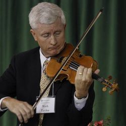 After giving a presentation, Mark Taylor performs "Precious Savior, Dear Redeemer" on the violin at Southern Virginia University's 17th annual Education Conference.