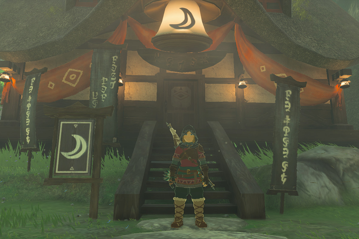Link stands in front of the inn in Kakariko Village in The Legend of Zelda: Tears of the Kingdom.
