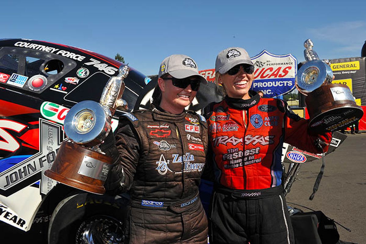 Pro Stock's Erica Enders (left) and Funny Car's Courtney Force celebrate their historic drag-racing victories Sunday at Seattle's Pacific Raceways following the O'Reilly Northwest Nationals. (Photo by Ron Lewis)