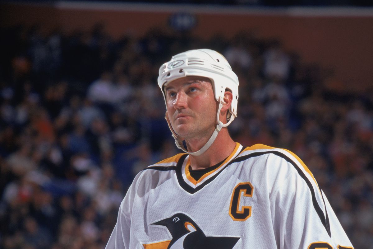 Mario Lemieux looks up during a break in play