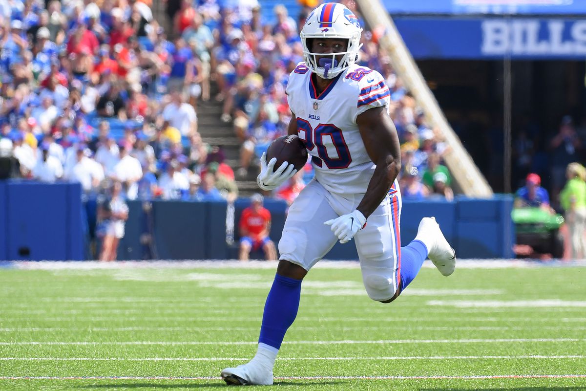 Buffalo Bills running back Zack Moss (20) runs with the ball against the Green Bay Packers during the second quarter at Highmark Stadium. Mandatory Credit: Rich Barnes