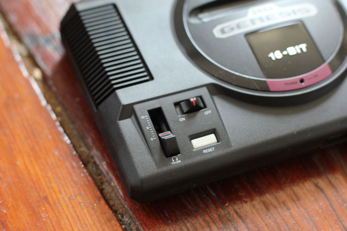 A photo of the Sega Genesis mini console on a hardwood floor.