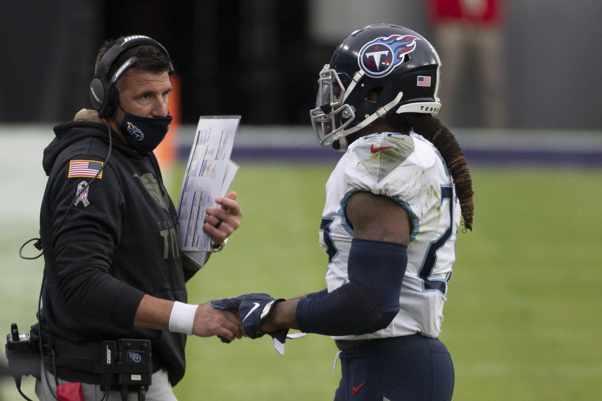Tennessee Titans running back Derrick Henry speaks with head coach Mike Vrabel during the second half against the Baltimore Ravens at M&amp;T Bank Stadium.