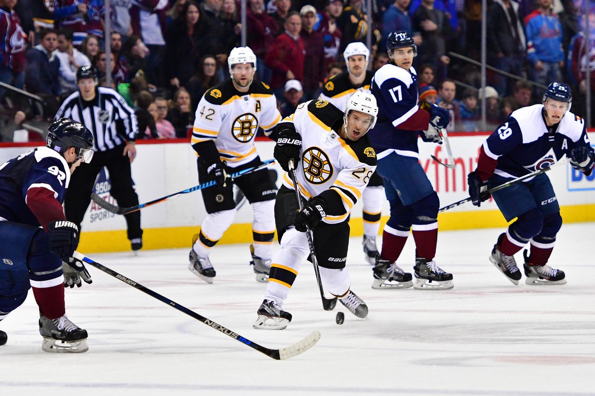 Dominic Moore seals the win with an empty netter, David Backes and Adam McQuaid look on 