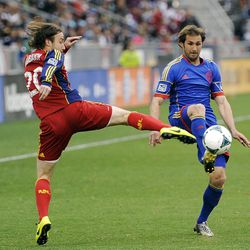 Real Salt Lake midfielder Ned Grabavoy, left, and Colorado Rapids midfielder Brian Mullan, right, fight for possession in the first half of an MLS soccer game in Commerce City, Colo., on Saturday, April 6, 2013. (AP Photo/Chris Schneider)
