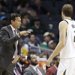 Utah Jazz head coach Quin Snyder, left, directs Joe Ingles (2) against the Charlotte Hornets during the second half of an NBA basketball game in Charlotte, N.C., Friday, Jan. 12, 2018. (AP Photo/Chuck Burton)