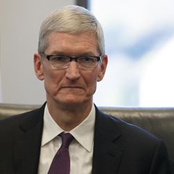 Apple CEO Tim Cook listens as President-elect Donald Trump speaks during a meeting with technology industry leaders at Trump Tower in New York, Wednesday, Dec. 14, 2016. 