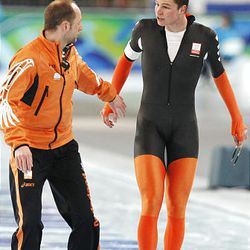 Netherlands's Sven Kramer, right, reacts after being disqualified for he forgot to switch a lane during the men's 10,000 meter speed skating race at the Richmond Olympic Oval at the Vancouver 2010 Olympics in Vancouver, British Columbia, Tuesday, Feb. 23, 2010.