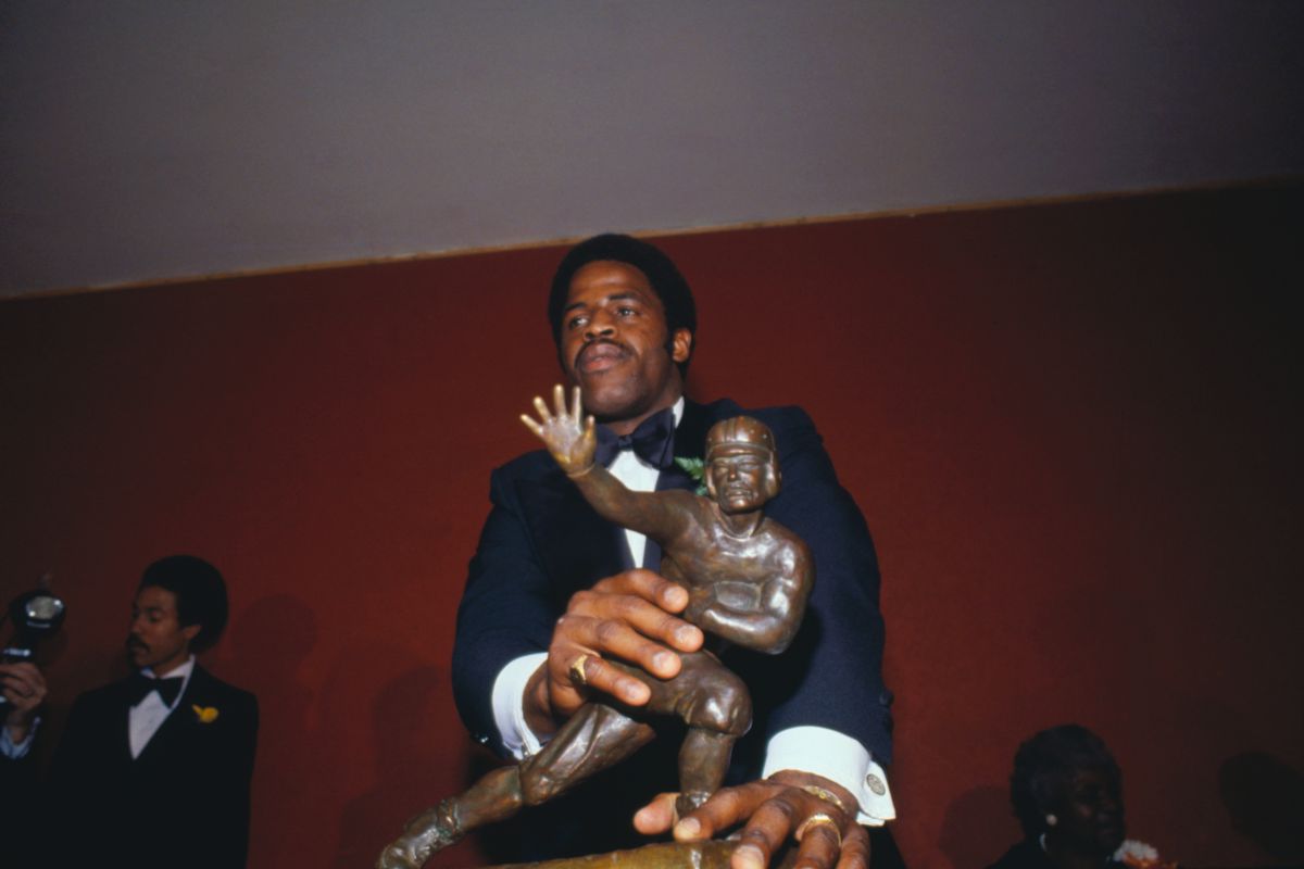 Earl Campbell with Heisman Trophy