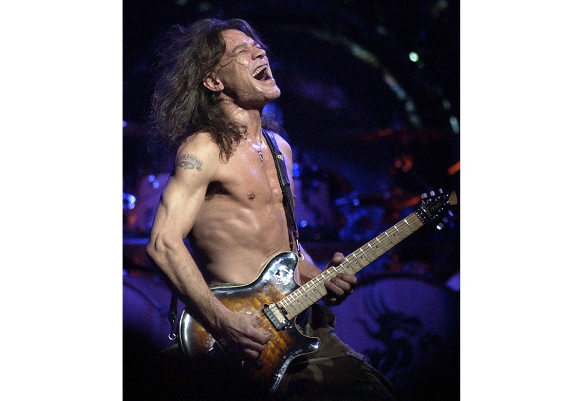This Aug. 5, 2004 file photo, shows Van Halen guitarist Eddie Van Halen performing in Phoenix.&nbsp;