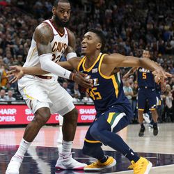 Cleveland Cavaliers forward LeBron James (23) is charged with a foul as he guards Utah Jazz guard Donovan Mitchell (45) in the final moments of the game at Vivint Arena in Salt Lake City on Saturday, Dec. 30, 2017.