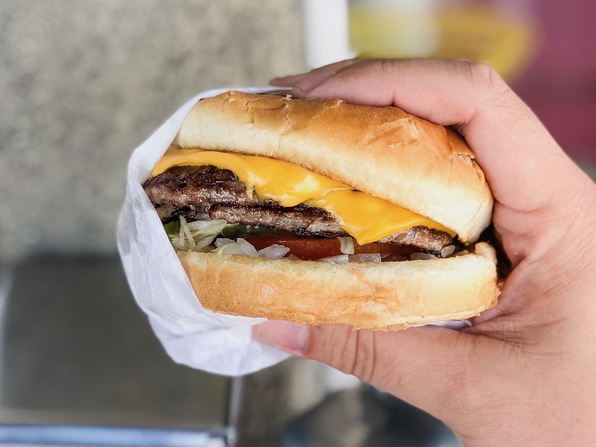A handheld burger with lots of cheese from Bill’s Burgers in the San Fernando Valley.