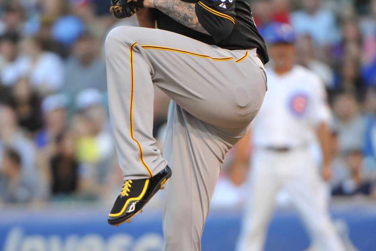 July 31, 2012; Chicago, IL, USA; Pittsburgh Pirates starting pitcher A.J. Burnett (34) delivers a pitch during the first inning against the Chicago Cubs at Wrigley Field.  Mandatory Credit: Rob Grabowski-US PRESSWIRE