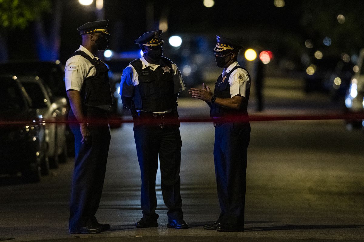 Chicago police investigate the scene where 4 people were shot including a 8-year-old boy in the 700 block of South Karlov in the Lawndale.