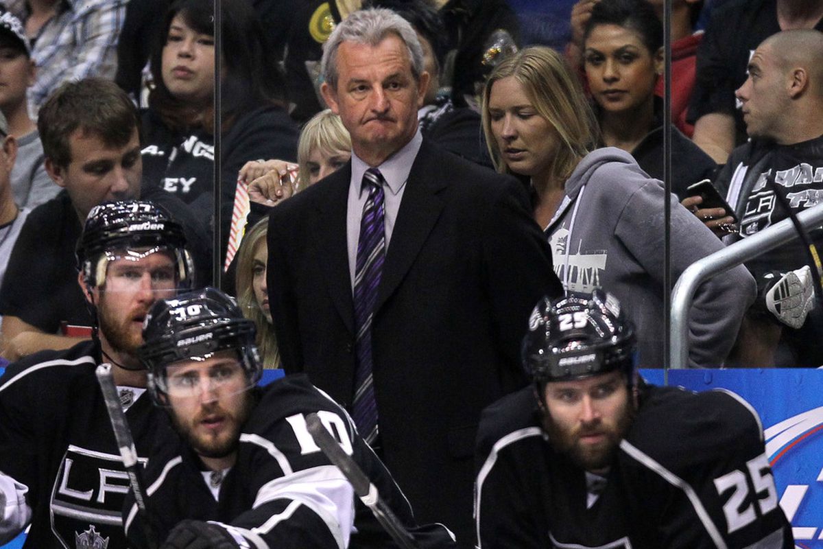 Darryl Sutter seen here trying to scratch an itch on his chin using his upper teeth.