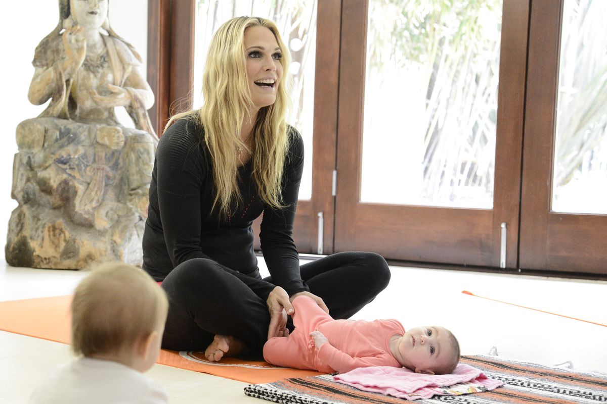 Molly Sims and daughter Scarlett May Stuber attend Tom's of Maine ‘Baby & Me’ yoga class in Los Angeles on Sunday, June 28, 2015. Sims and Stuber participated along with other new moms in a gentle flow class, led by Zooga Yoga, designed to help parents ma