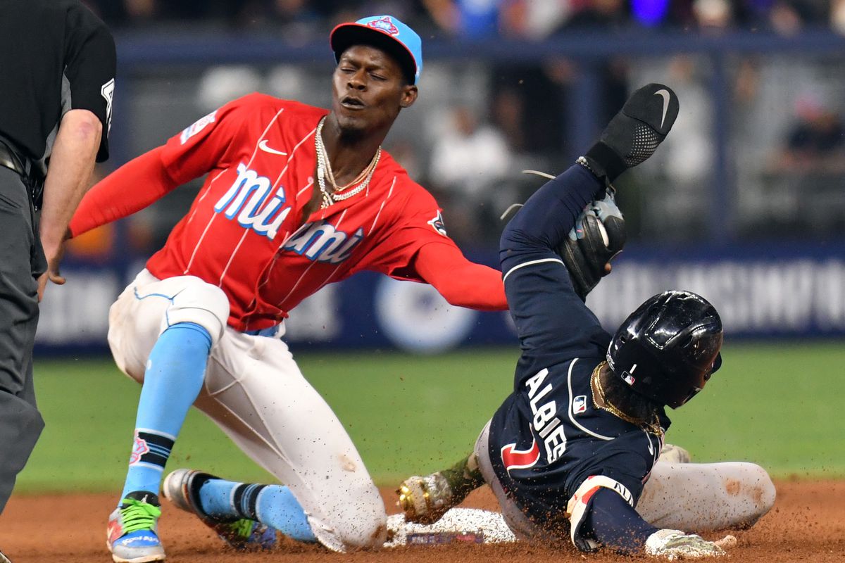 Miami Marlins second baseman Jazz Chisholm Jr. (2) tags Atlanta Braves second baseman Ozzie Albies (1) out at second base in the eighth inning at loanDepot Park.