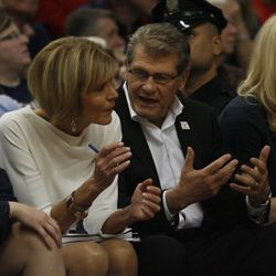 UConn head coach Geno Auriemma talks with UConn associate head coach Chris Dailey during the Notre Dame Fighting Irish vs UConn Huskies women's college basketball game in the Women's Jimmy V Classic at the XL Center in Hartford, CT on December 3, 2017.