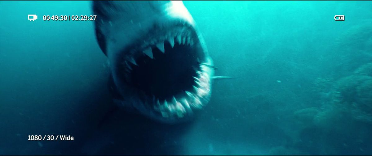 A first-person shot of a Great White Shark opening its jaw to swallow a camera in The Shallows.