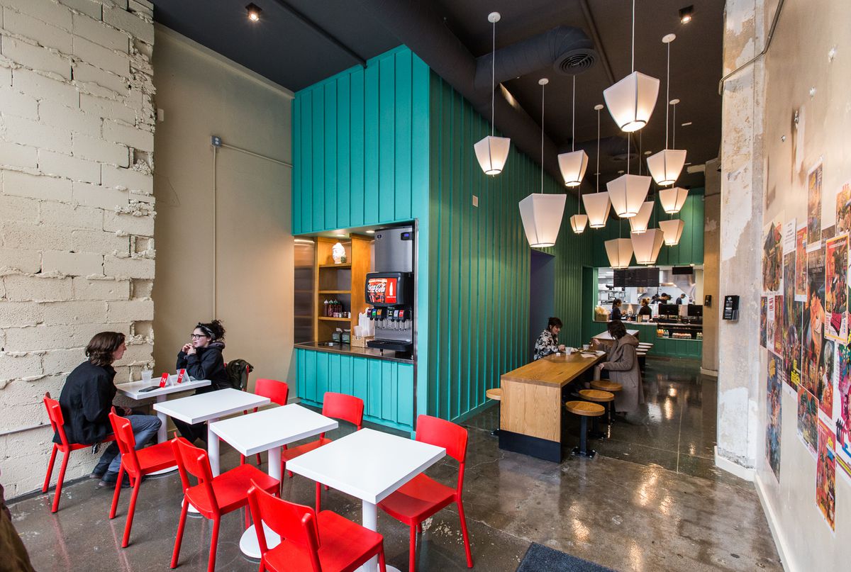 the blue walk-up counter at go! sy thai with red chairs and white tables and a long wood table