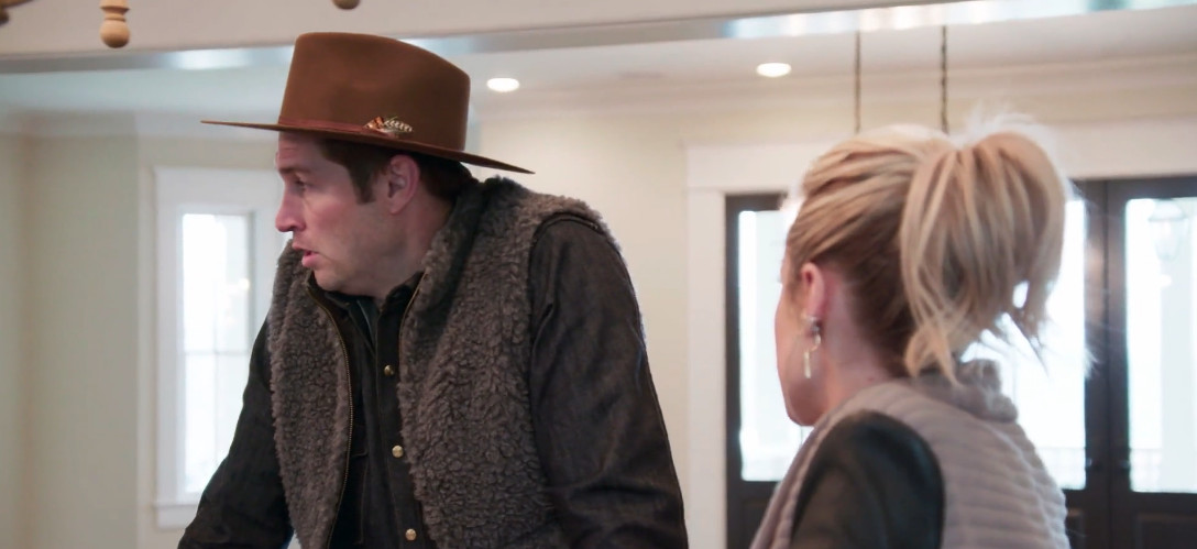Jay Cutler wearing a fur vest standing next to Kristin
