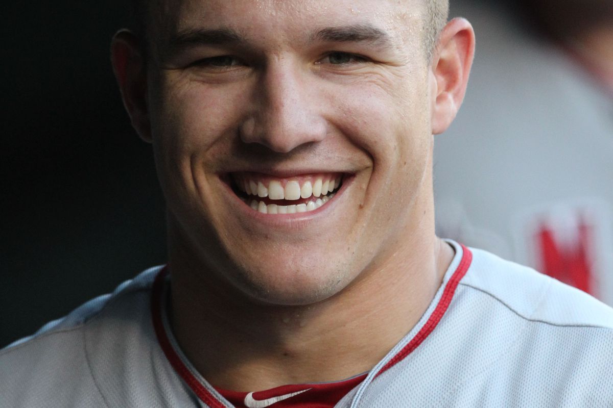 Aug 2, 2012; Arlington, TX, USA; Los Angeles Angels outfielder Mike Trout (27) smiles in the dugout prior to the game against the Texas Rangers at Rangers Ballpark.  Mandatory Credit: Matthew Emmons-US PRESSWIRE