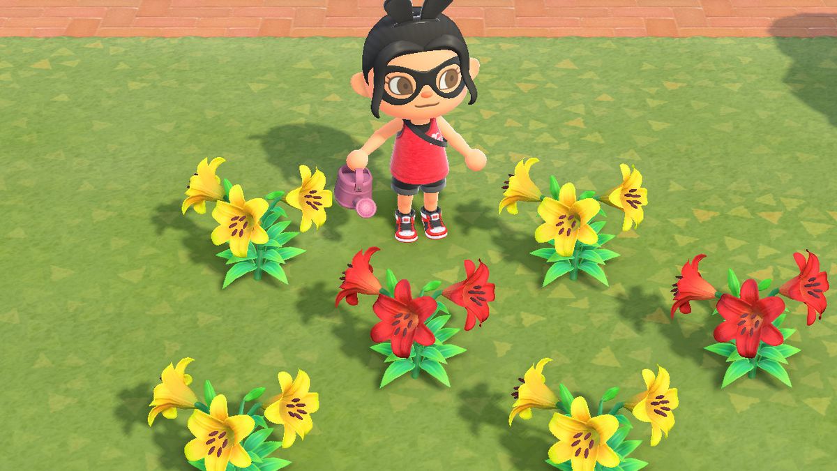 An Animal Crossing character with a pink watering can stands near yellow and red lillies