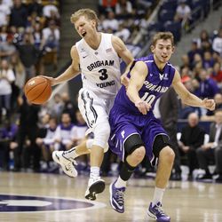 Brigham Young Cougars guard Tyler Haws (3) is fouled by Portland's Jason Todd as Brigham Young University defeats Portland 97-88 in NCAA men's basketball Monday, Dec. 29, 2014, in Provo.  
