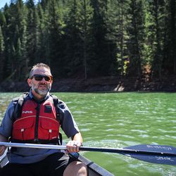 Joshua Hansen, Continue Mission's founder, paddles around Tibble Fork in American Fork Canyon during a Veterans outing for Continue Mission on Aug. 17, 2017.