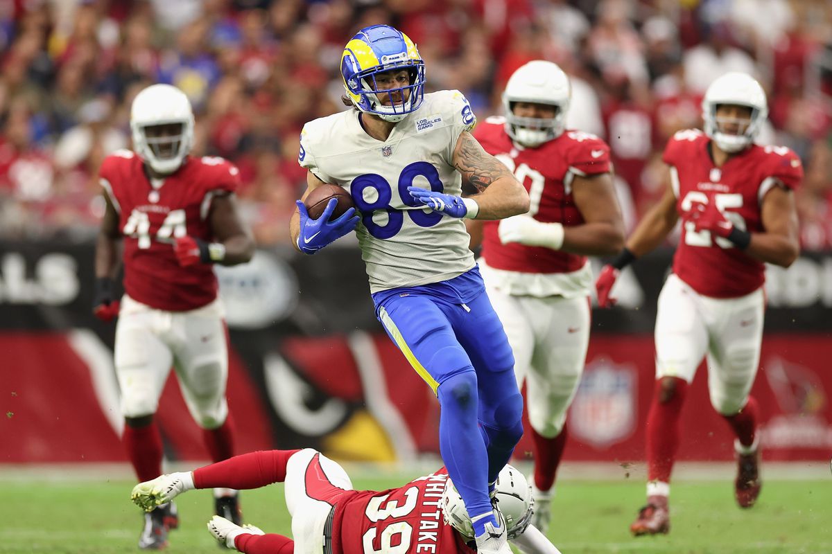 Tight end Tyler Higbee #89 of the Los Angeles Rams runs with the football after a reception against the Arizona Cardinals during the second half of the NFL game at State Farm Stadium on September 25, 2022 in Glendale, Arizona. The Rams defeated the Cardinals 20-12.