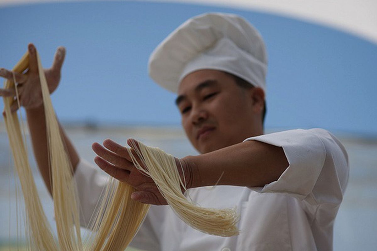 Chef from Alameda's Ark Restaurant, Noodle pulling at Eat Real. 