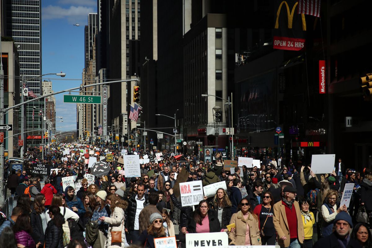 March for Our Lives protesters cross West 46th Street in New York City.